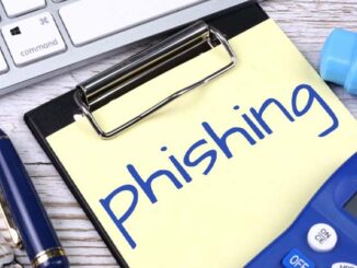 Post-it labelled 'PHISHING' on a bookmark, illustrating online phishing scams.